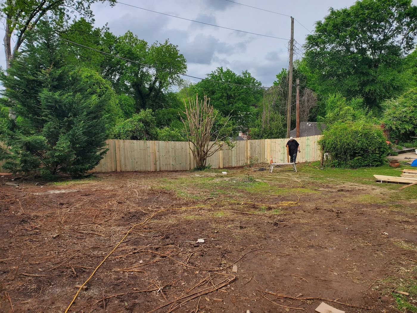 Liberty Fence crew finishing an Amish board privacy fence