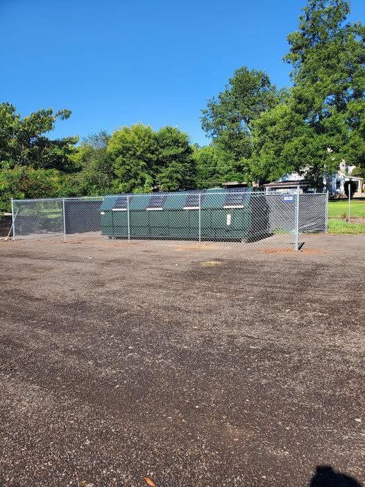 Chain link enclosure built for the City of Oxford recycling bins
