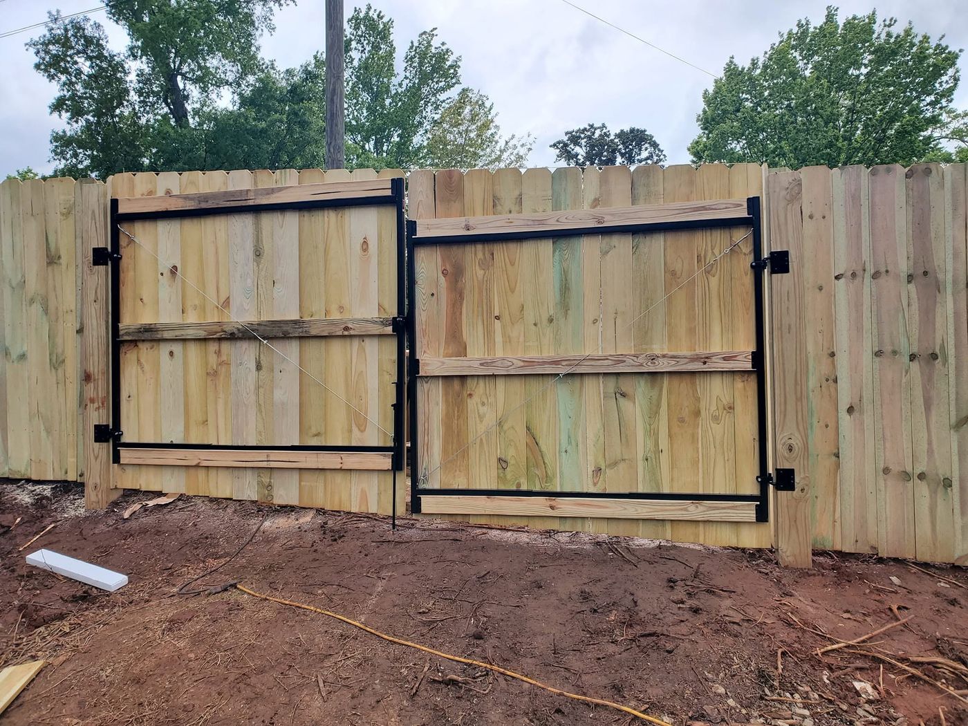 Double drive gates on steel frames during installation
