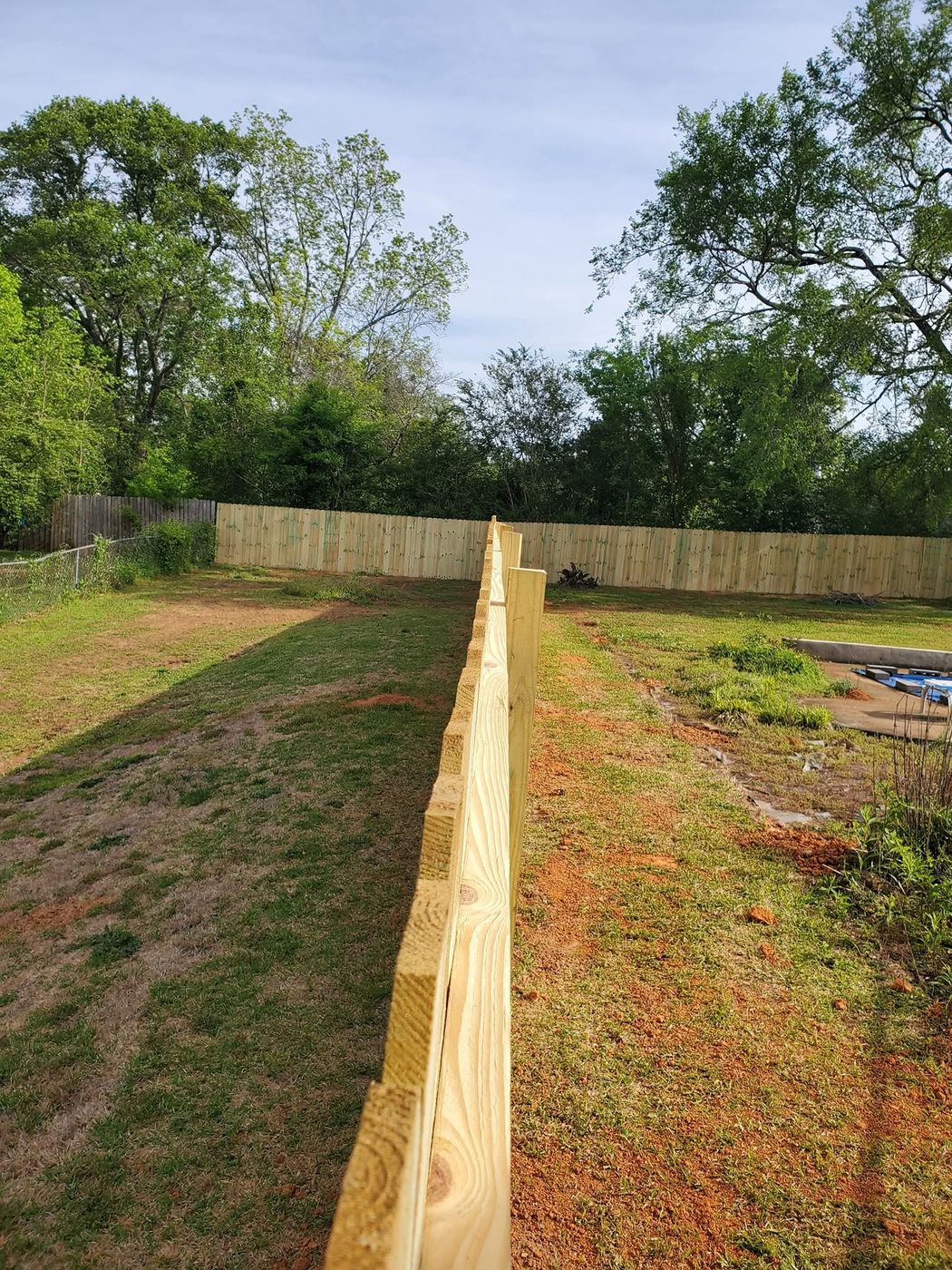 Straight post line set for a new wood privacy fence