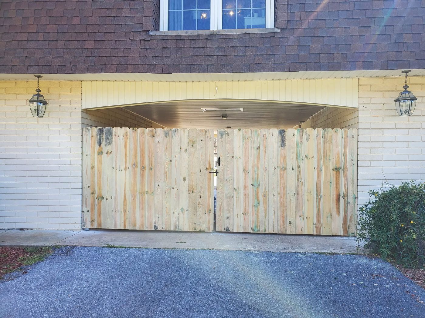 6 foot wood privacy fence with gate and Liberty Fence sign